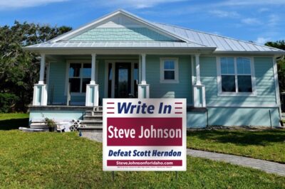 Steve Johnson yard sign in front of a small house